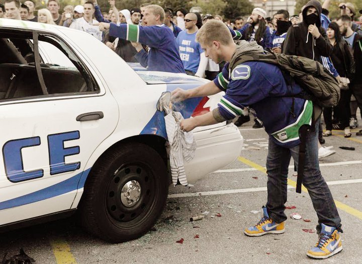 Nathan Kotylak trying to set a police cruiser on fire