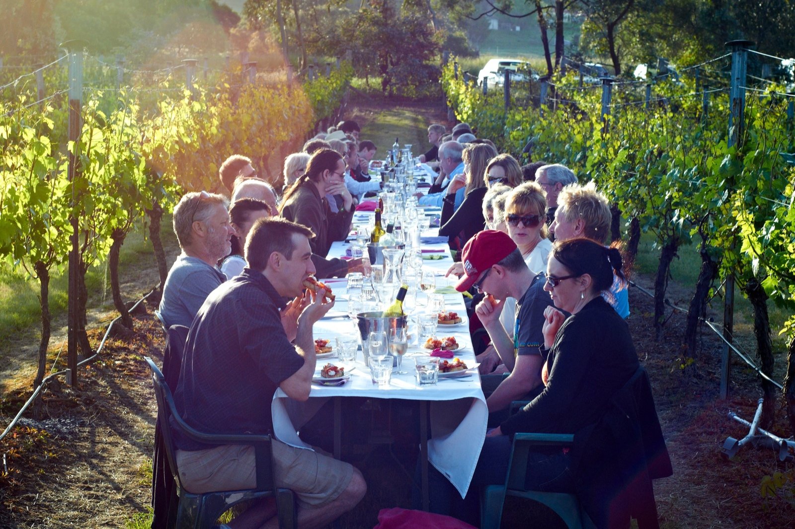 A long dinner table at dusk