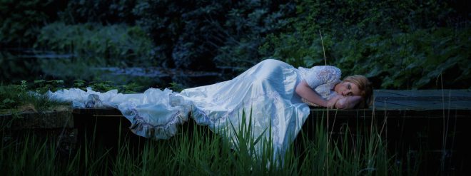Woman sleeping in grass