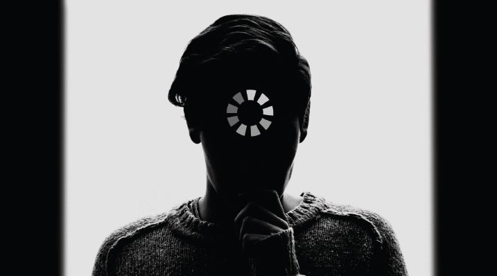 silhouette of a person with "loading" symbol over their face